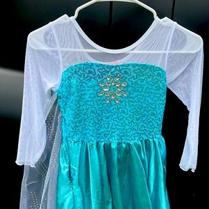 Never worn Elsa 6-7 dress. For dress up play.